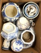 A box containing blue and white Delft pottery vase