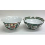 Two Chinese decorated bowls on pedestal feet. Est.