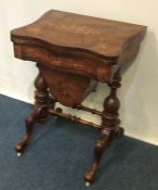 An attractive Victorian hinged top games table inl