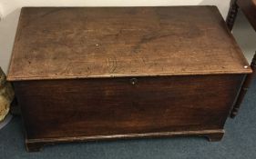 A mahogany hinged top blanket box. Est. £20 - £30.