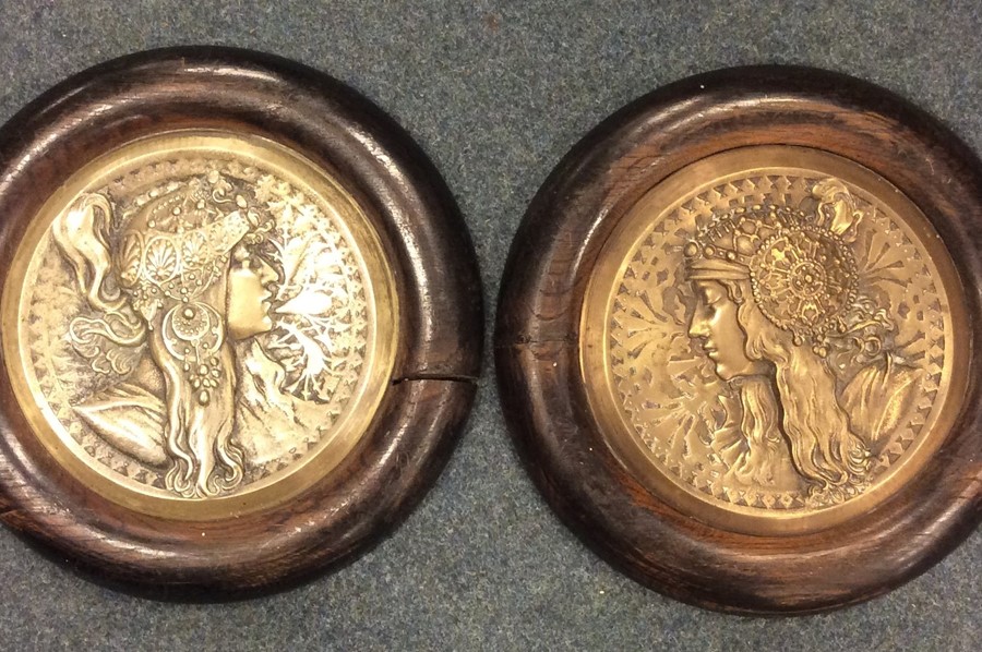 A pair of Art Nouveau circular brass plaques in oa