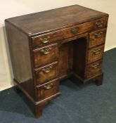 A good quality Georgian seven drawer knee hole des