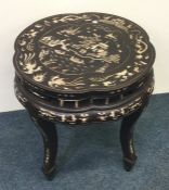 A Chinese ivory inlaid jardiniere stand decorated