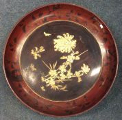 A large circular lacquered Japanese charger with i