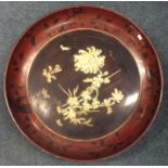 A large circular lacquered Japanese charger with i