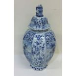 A Dutch blue and white vase and cover decorated wi