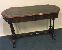 A good quality walnut centre table with scroll dec