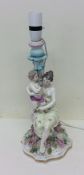 An attractive porcelain lamp depicting a mother an