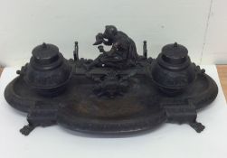 A large good quality bronze inkstand decorated wit