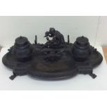 A large good quality bronze inkstand decorated wit