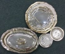 A large silver plated entrée dish together with a