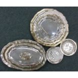 A large silver plated entrée dish together with a