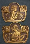 A good pair of cast wall plaques depicting stylise