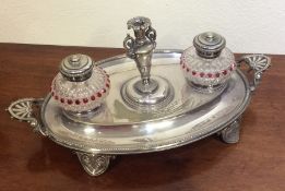 A good quality oval inkstand with cranberry glass