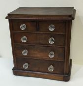 An attractive flame mahogany apprentice chest with