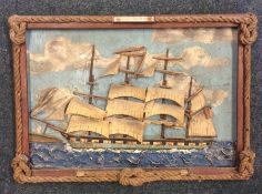An unusual framed picture of a ship under sail in