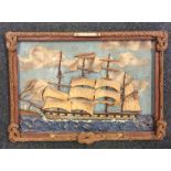 An unusual framed picture of a ship under sail in