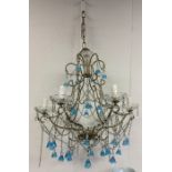 A stylish blue glass chandelier with matching drop