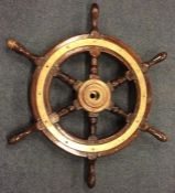 An Antique brass and mahogany ship's wheel. Est. £