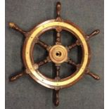 An Antique brass and mahogany ship's wheel. Est. £