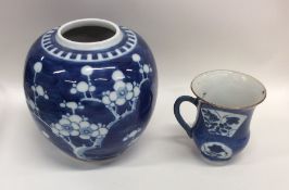 A Chinese blue and white vase together with a tape