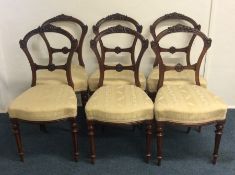 A set of six mahogany dining chairs on fluted supp