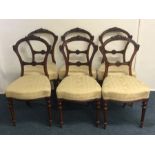 A set of six mahogany dining chairs on fluted supp