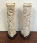 A pair of ornate trench art carved tapering vases.