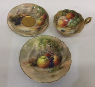 A Royal Worcester hand painted cabinet cup and sau
