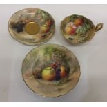 A Royal Worcester hand painted cabinet cup and sau