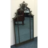 A large triple mirror attractively decorated with