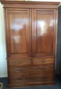 An Edwardian mahogany four drawer linen press. Est