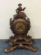 A French brass mantle clock decorated with scrolls