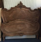 A good Continental bed frame with scroll decoratio