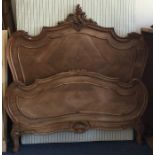 A good Continental bed frame with scroll decoratio