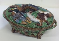 A Minton pottery game dish of typical design on sp