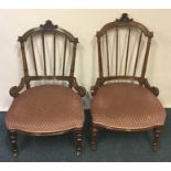 A pair spindle back mahogany low chairs. Est. £30