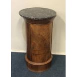 An unusual Continental mahogany pot cupboard with