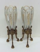 A good pair of French gilded spill vases on three