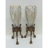 A good pair of French gilded spill vases on three