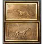 A pair of good quality brass plaques in the form o