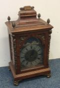 A good quality burr walnut bracket clock with stri