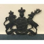 A classical cast iron plaque in the form of a stag