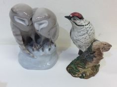 A Beswick figure of a woodpecker together with a R