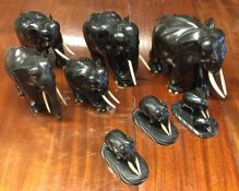 A good group of eight ebony elephants with ivory t