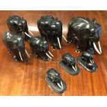 A good group of eight ebony elephants with ivory t