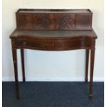 A reproduction serpentine fronted lady's desk. Est