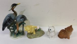 Two Beswick cats together with a Royal Doulton fig