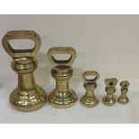 A good set of six tapering brass weights. Est. £70