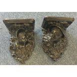 A good pair of carved wall brackets decorated with